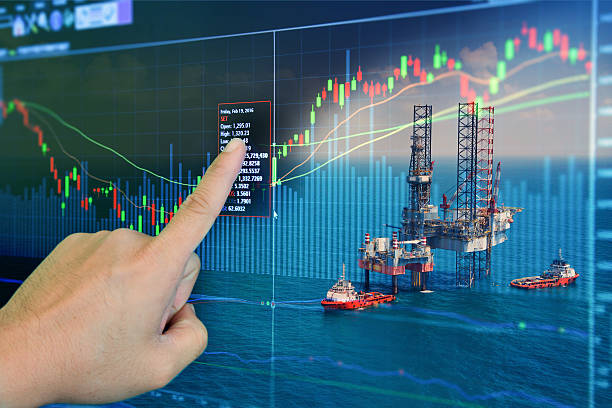 Stock market concept with oil rig in the gulf and oil refinery industry background,Double exposure